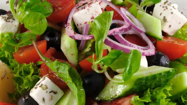 Close-up view of Greek salad with feta cheese, fresh vegetables and olives, 4K, ProRes codec, 422 HQ, ISO 100