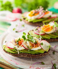 Open sandwiches with avocado and egg