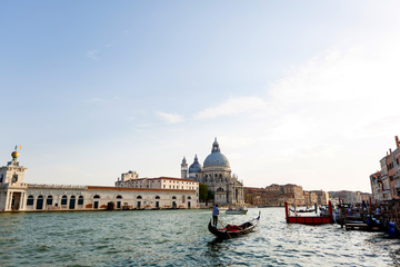 Fototapeta na wymiar Gondola on Canal Grande with Basilica di Santa Maria della Salute in the background, Venice, Italy