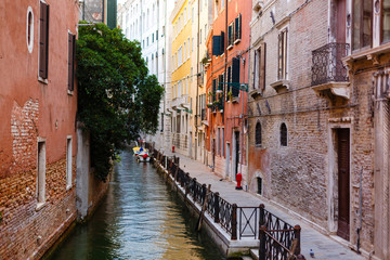 Fototapeta na wymiar Narrow canal in Venice, Italy