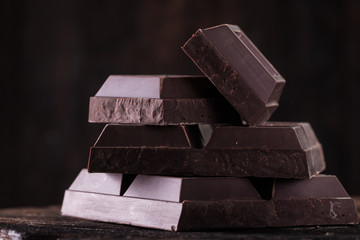 Dark chocolate stack, on wooden table,chocolate concept background