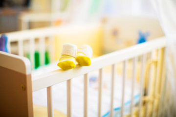 Children  shoes in a cot