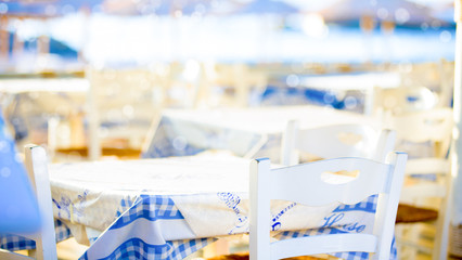 Outdoor cafes in coastline resort Kamari in Santorini Greece