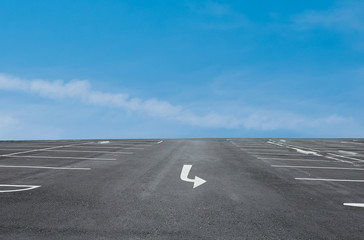 Fototapeta premium Empty parking place with blue sky background