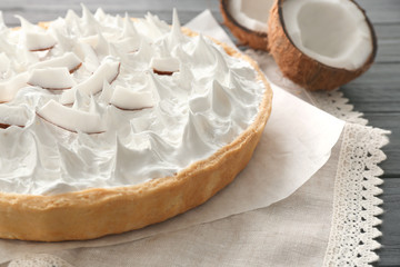 Delicious cream pie and coconut halves on vintage napkin