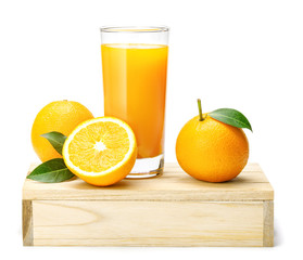 Glass of fresh orange juice with group of orange on a wooden box isolate on white background, Selective focus on glass.