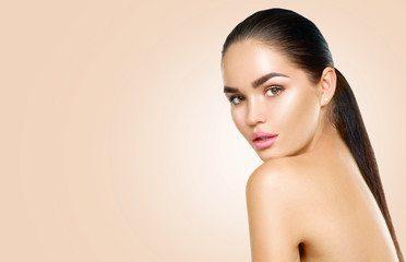 Beauty brunette spa model girl with perfect skin. Spa, skincare and body care concept