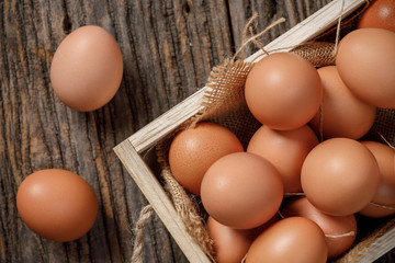 Fresh eggs in wooden box on wooden table, Chicken Egg