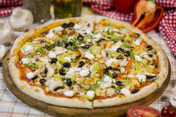 Italian pizza with mushrooms, cheese and olives. Classical Italian pizza.
