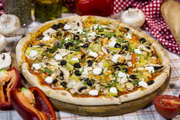 Italian pizza with mushrooms, cheese and olives. Classical Italian pizza.