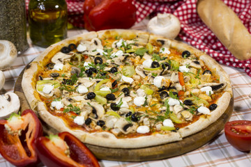 Italian pizza with mushrooms, cheese and olives. Classical Italian pizza.