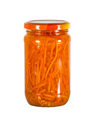 Marinated carrots in a glass jar, isolated on white