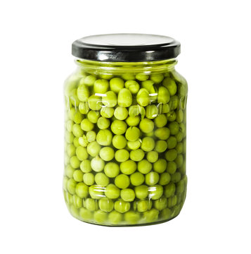 The green peas in a glass jar isolated on white
