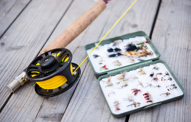 Fly fishing equipment on bench © mooseshop
