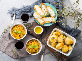 Lunch with curry pasta noodles in bowls and vegetables with turmeric