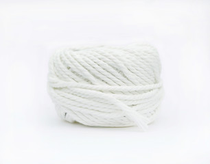 Roll of white yarn thread isolated on white background.