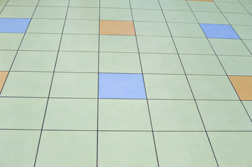 Background of square tiles of natural materials