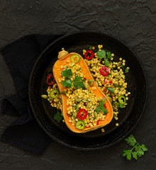 Baked pumpkin stuffed with salad from bulgur.