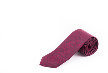 Silk necktie on a white background. Burgundy Italian tie. Copy space