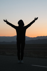 Fototapeta premium woman silhouette at sunset