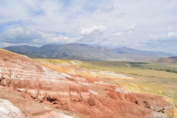 Slopes of red and yellow hills. Martian landscape of Altai mountains. Altay Republic, Russia.
