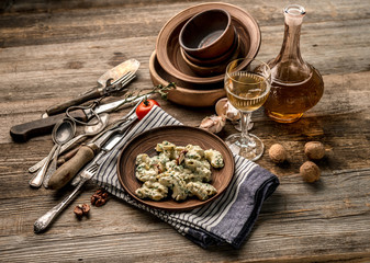 Old-fashioned dishware with pasta