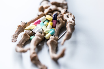 Hand bones and Dangerous drugs that affect health.