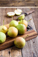 Ripe organic pears on rustic wooden table