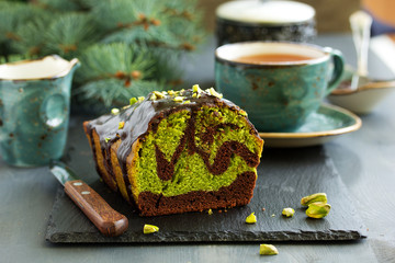 Chocolate pistachio cake with frosting.