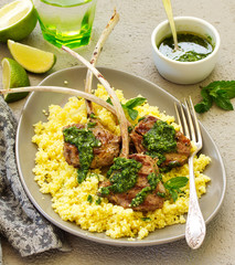 Lamb chops on bone, with mint-garlic sauce and couscous.