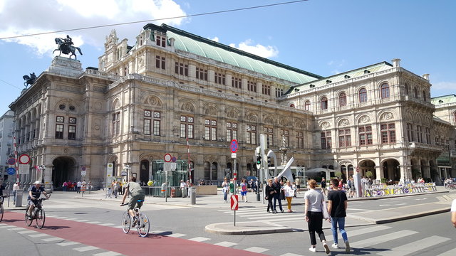 People walking in front of Vienna State Opera buidling