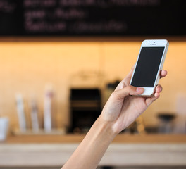Close Up Of hand Woman Using Mobile Phone In cafe