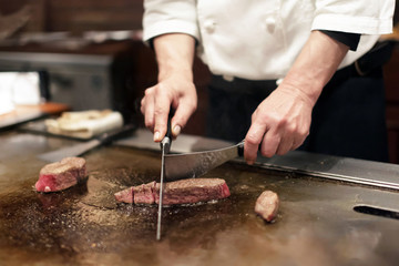 Chef Preparing KOBE Beef and Side at Restaurant