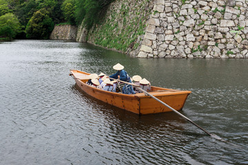 Fototapeta na wymiar Japanese Tourist River Boat Vintage Transportation with Passenger form behind