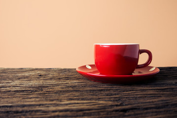 red coffee cup wood texture table