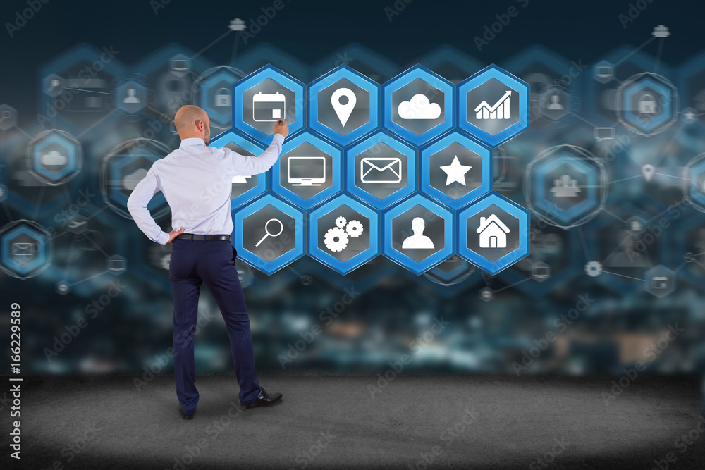 Poster businessman in front of a wall with application center displayed on a futuristic interface with tech