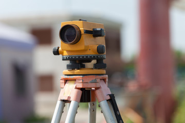 Surveyor equipment tacheometer or theodolite outdoors at construction site
