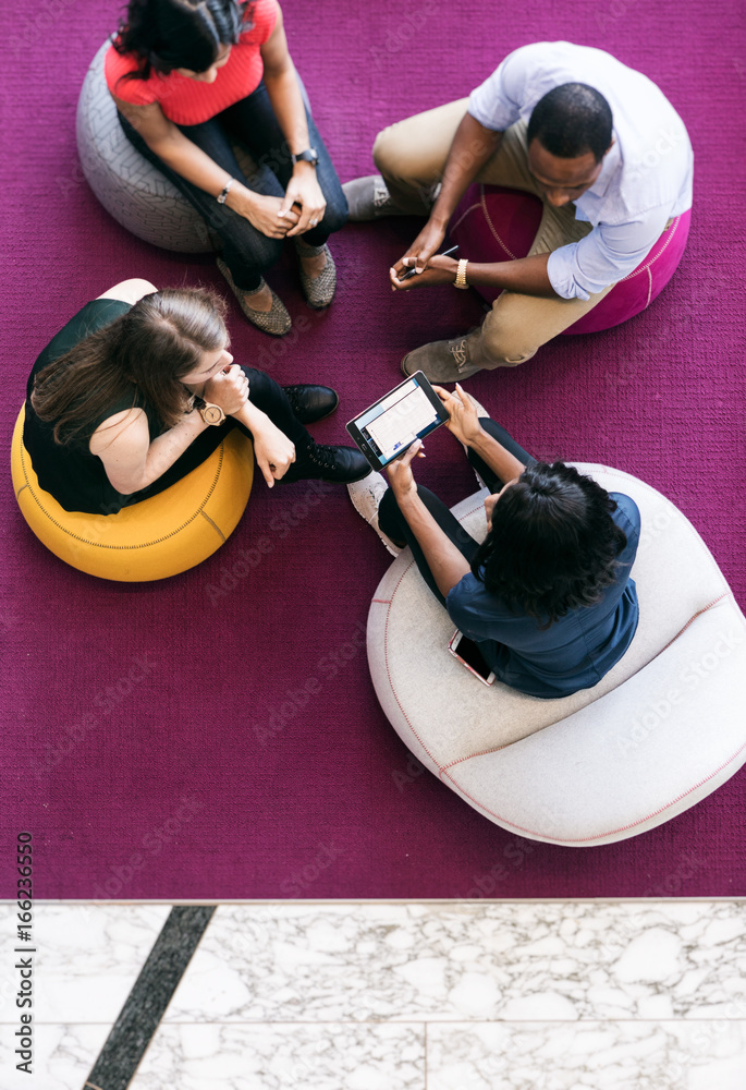 Wall mural workspace: overhead group of casual employee meeting