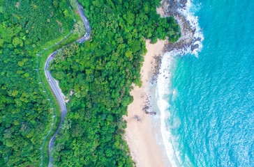Sea aerial view,Top view,amazing nature background.The color of the water and beautifully bright.Azure beach with rocky mountains and clear water of Thailand ocean at sunny day.Winding road.