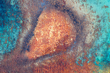 Rusty metal surface with peeling paint