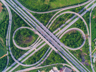Aerial view, Road roundabout, Expressway with car lots in the city in Thailand.  beautiful Street , downtown, cityscape, Top view. Background