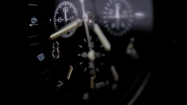 Mens Watch made metal with sapphire glass. Macro video. Time is running out. Close-up of watch with metal  arrows