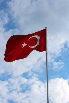 Turkish flag against the background of summer sky