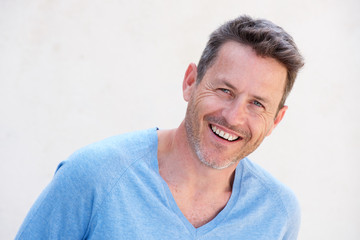 Obraz premium Close up cheerful older man standing isolated on white background