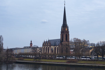 Fototapeta na wymiar View of Dreikonigskirche Protestant Church by main river in Fran