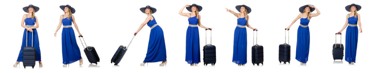 Young woman in blue dress and suitcase isolated on white