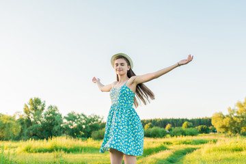 Beauty Girl outdoors enjoying summer nature.