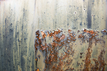 Abstract of painted rusting metal surface