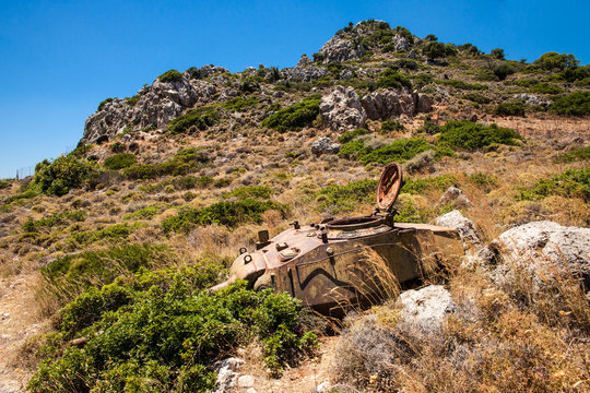 Destroyed tank on the hill. Old upper part of the tank remains after the war in Greece.