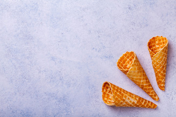 Waffle ice cream cone on a light background